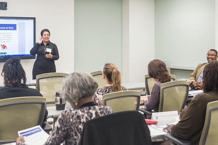 An audience in a bright seminar room